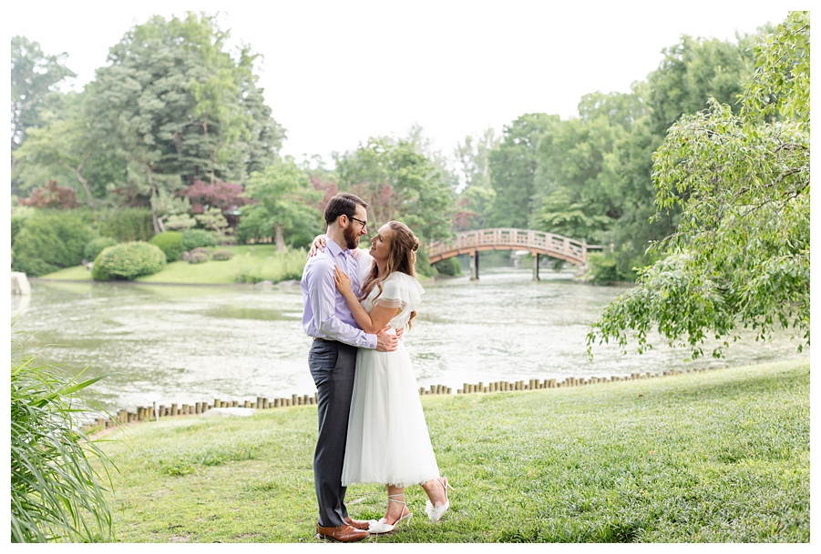 Engaged couple embracing during a romantic engagement session at the Missouri Botanical Garden in St. Louis, Missouri